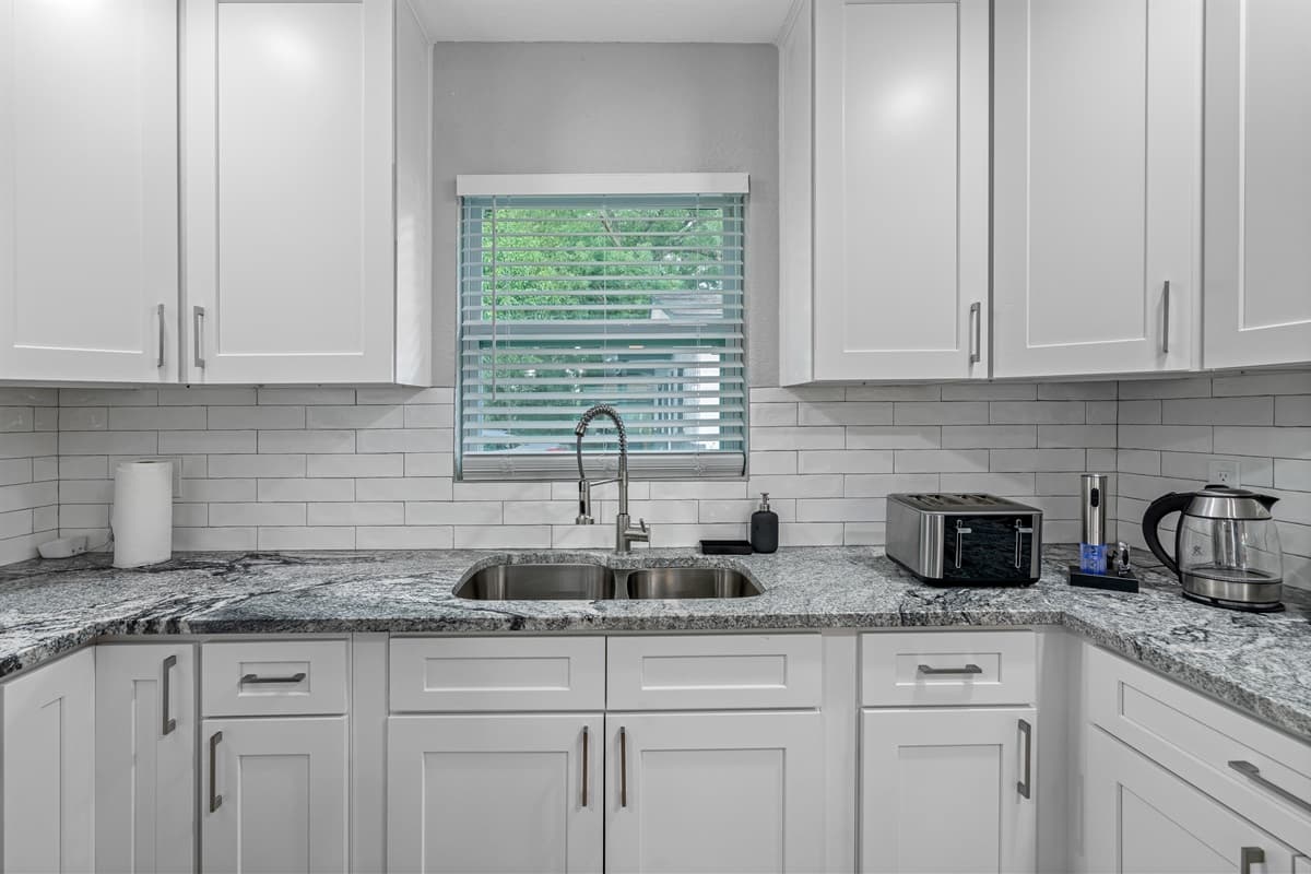 Our spacious modern kitchen has a lot of storage too! It's equipped with a dishwasher and has a lot of cabinets and drawers for kitchen tools and utensils. If you like this property, don't hesitate to send us a message.