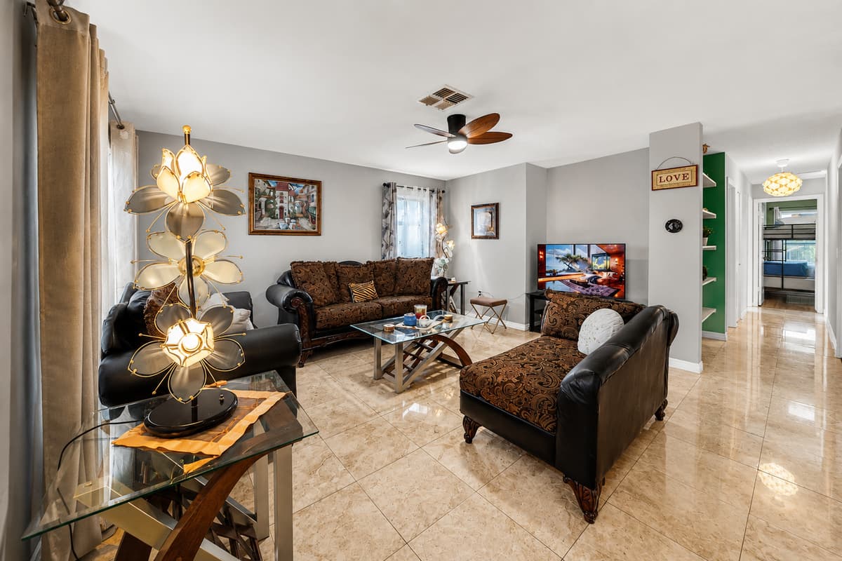 Plenty of seating and natural light create the perfect atmosphere for relaxing after a day at the beach.