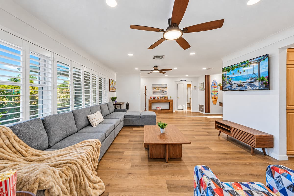 Expansive living space with oversized sectional and open layout—ideal for group comfort and connection 