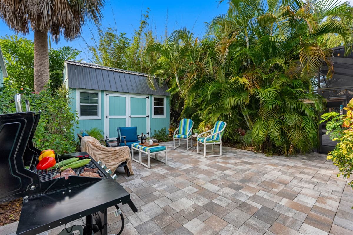 A charming patio space featuring comfortable seating, ideal for unwinding with a drink or good conversation.