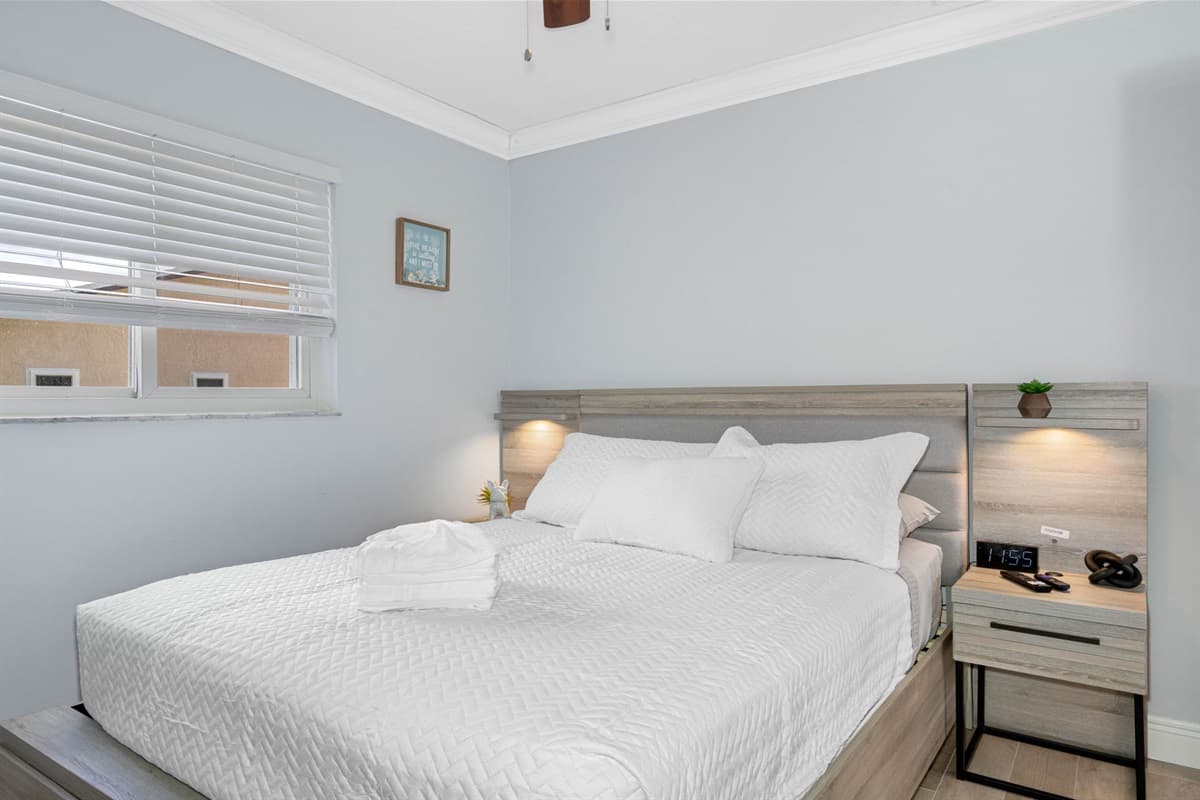 The bed's elegant design and soft textures create a warm and welcoming atmosphere, making it an ideal sanctuary for relaxation.