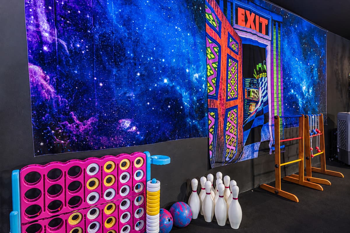 Bowling lane, connect four, and an arcade wall — the game room has more than most arcades do.