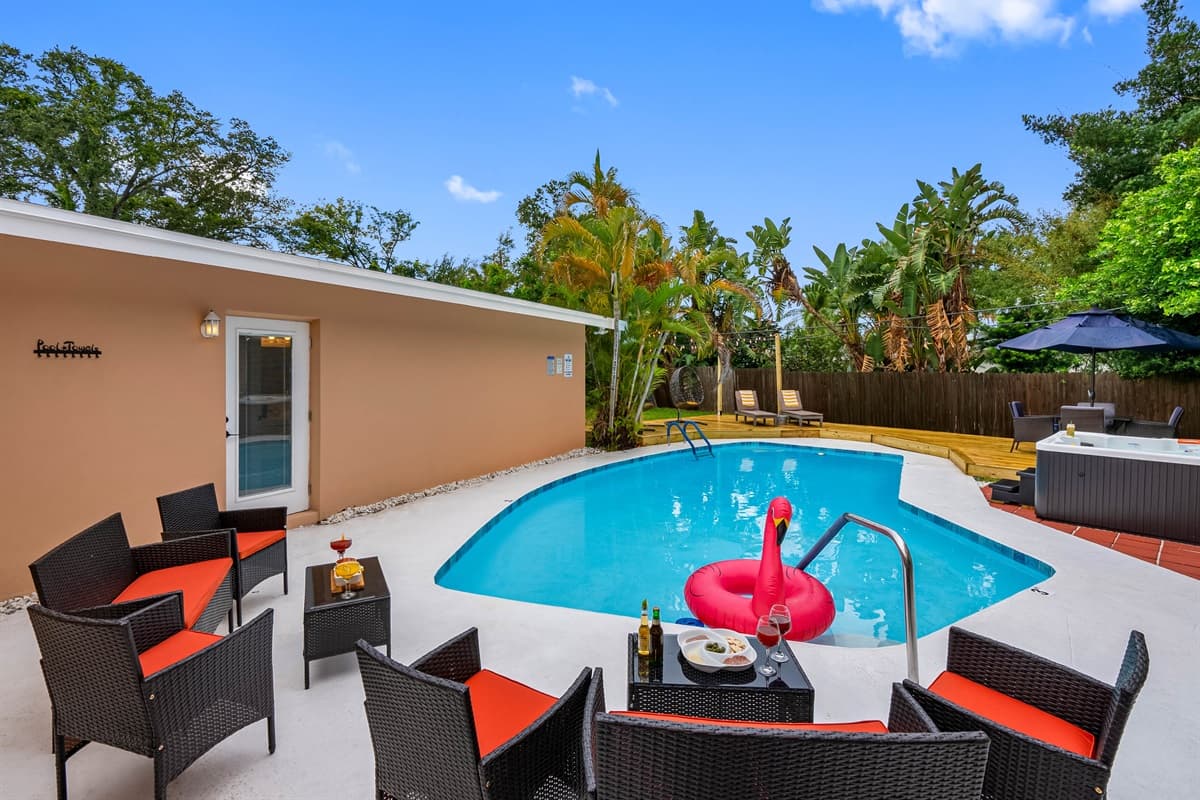 Swim, sip, and savor the outdoors with poolside dining, hanging egg chairs, and a resort-inspired layout made for vacation living.