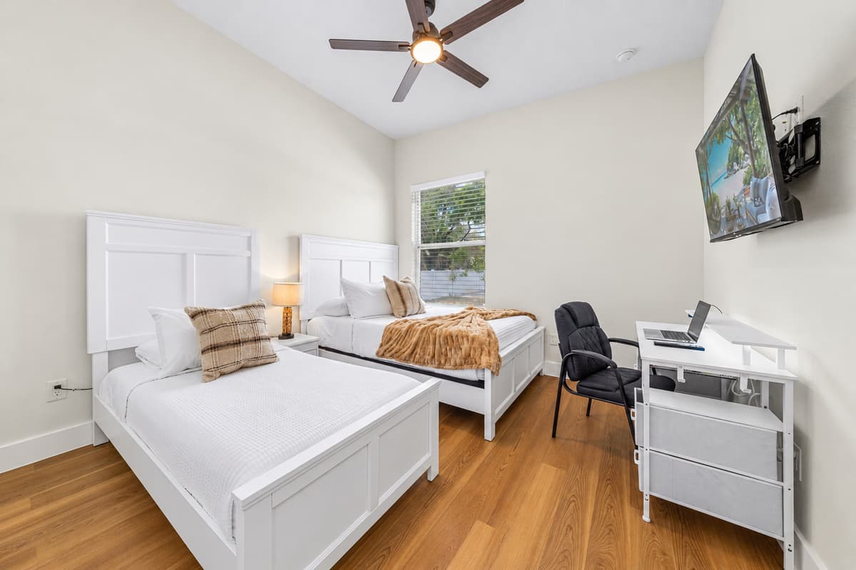 Wind down with soft bedside lighting and a plush bed — the perfect end to a day exploring Tampa.