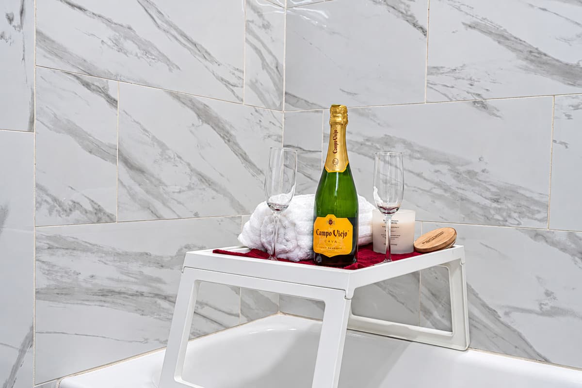 Relax after a very long and tiring day of travel and activities during your stay in this beautiful bathroom that has a sink, bathtub, vanity and shower! Send us a message if you have any questions regarding this property!