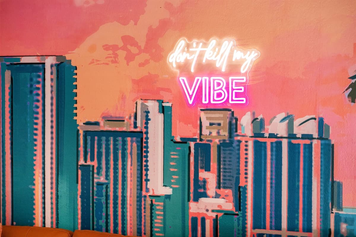 Bright, airy, and stylishly curated, the space features a sophisticated color palette infused with bold pops of coral, turquoise, and gold, reflecting the lively energy of the city.