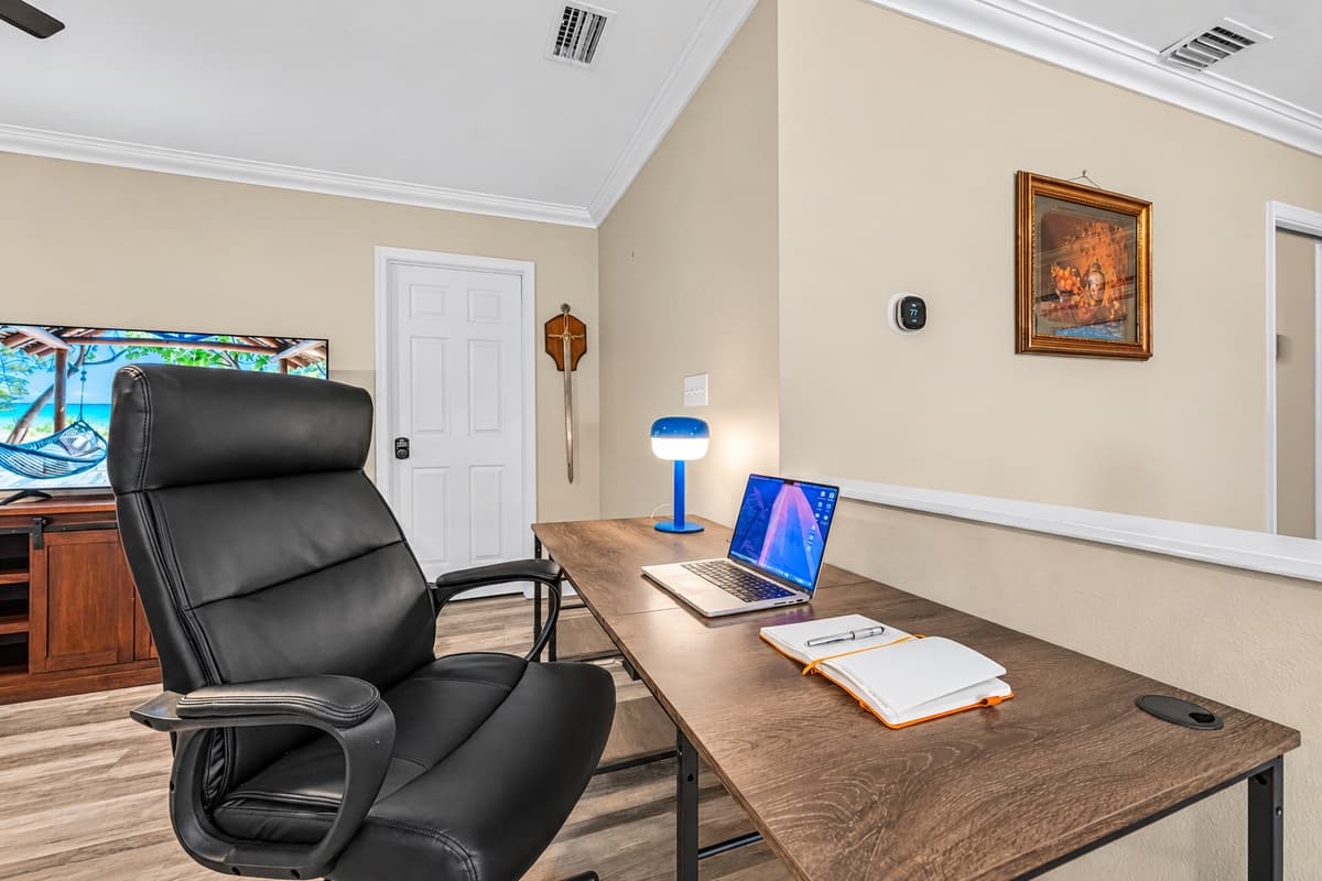 Dedicated workspace with desk, comfortable chair, and open view—perfect for remote work or planning your day.