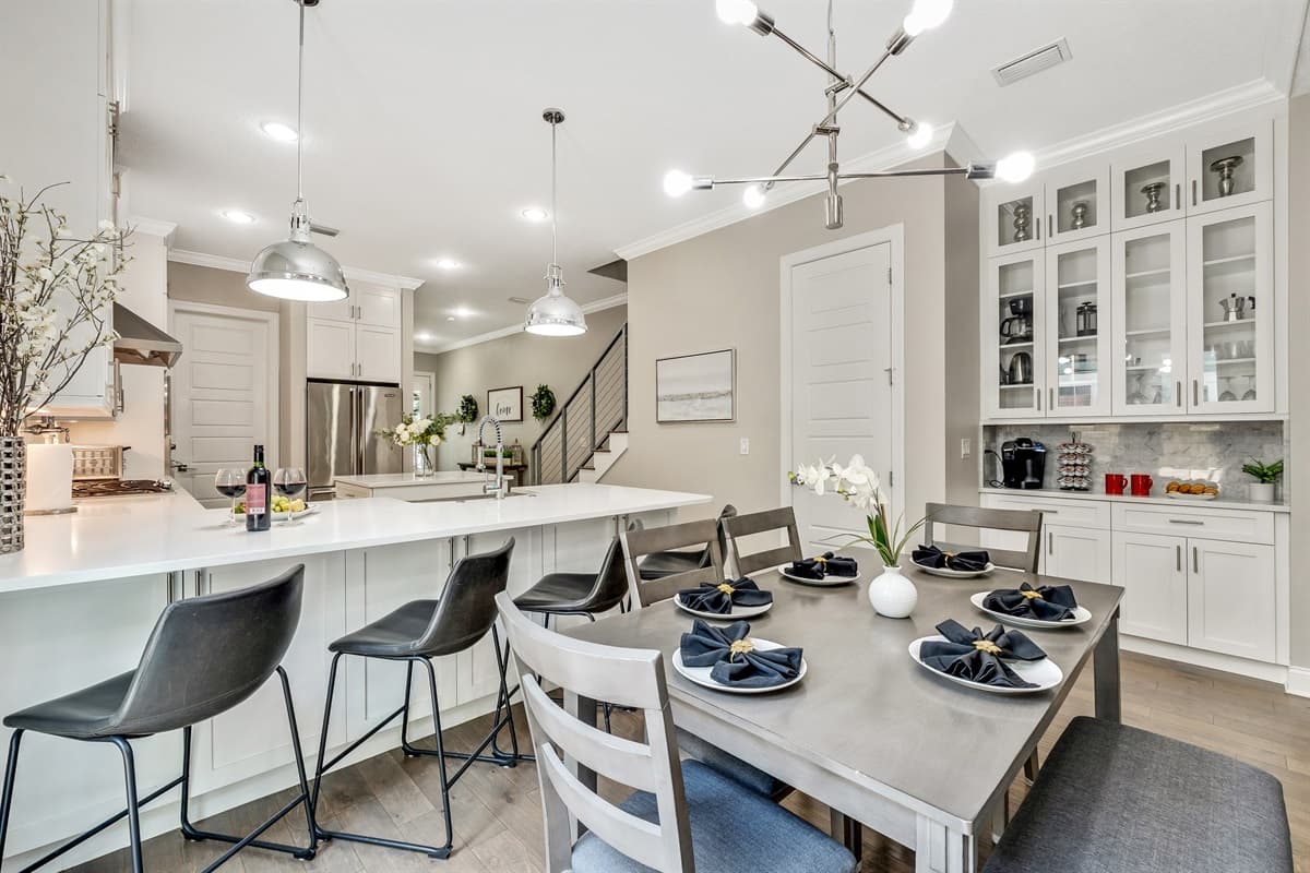 One of the kitchen's standout features is the beautiful breakfast table, an inviting spot that encourages casual dining and intimate gatherings.