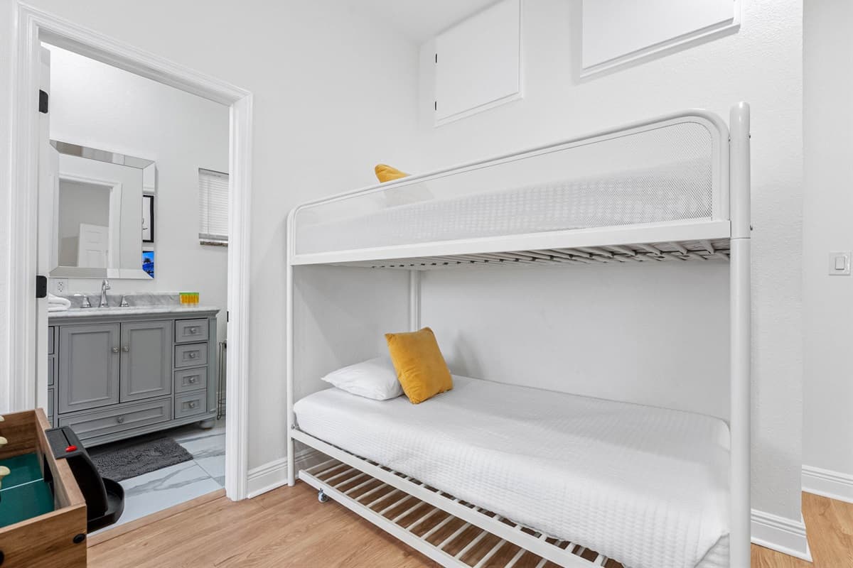With bunk beds and open floor space, this room is ideal for children or extra guests while doubling as a dedicated entertainment area.