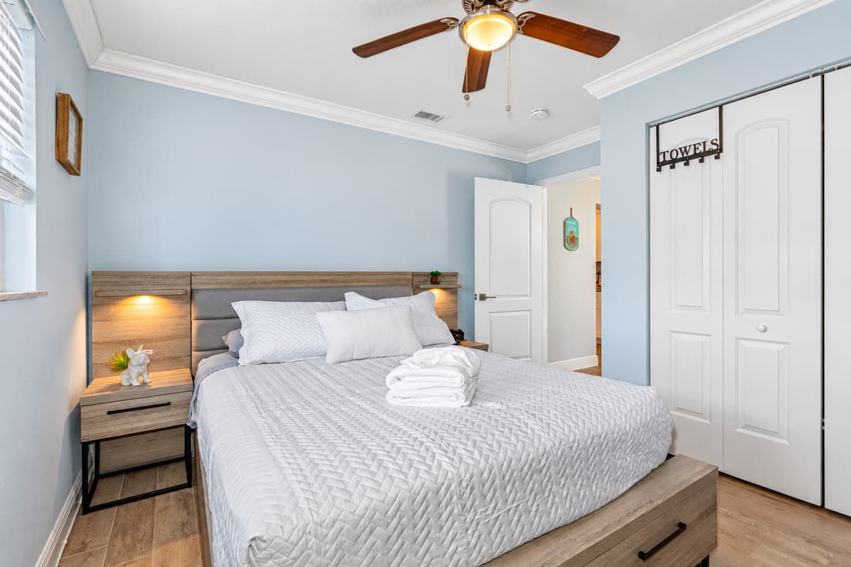 This inviting space features a queen-size bed, ensuring a restful night's sleep with its plush mattress and high-quality linens.