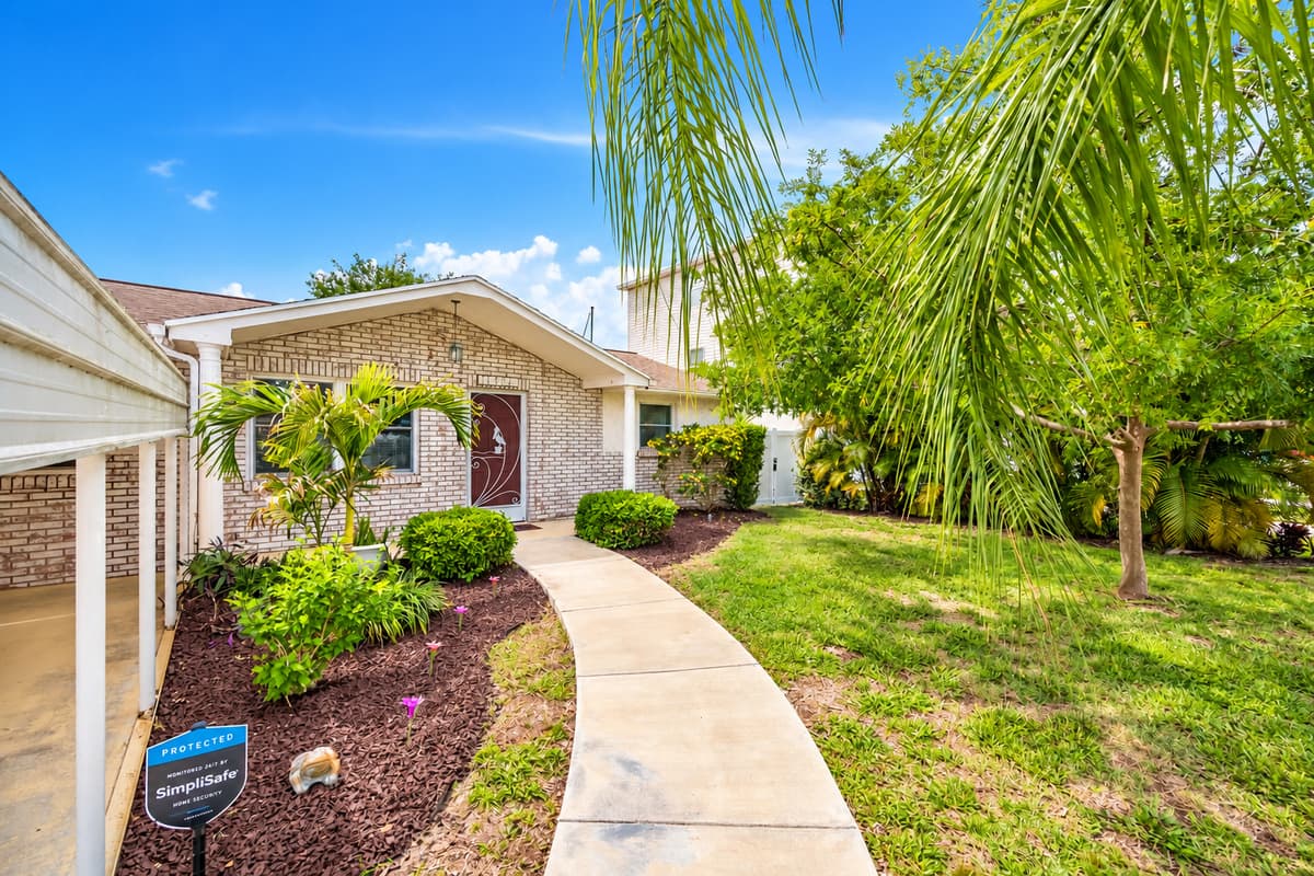 This gorgeous entryway will welcome you and make you feel at home once you reach the property that has beautiful plants and a well maintained lawn. If you like what you see, send us an inquiry!