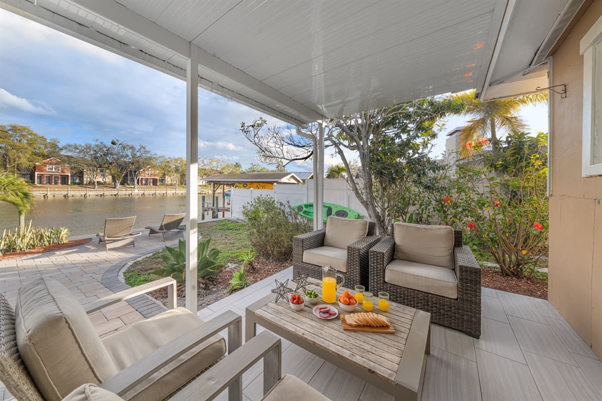 Enjoy your morning coffee or unwind at sunset on the screened-in lakeside patio.
