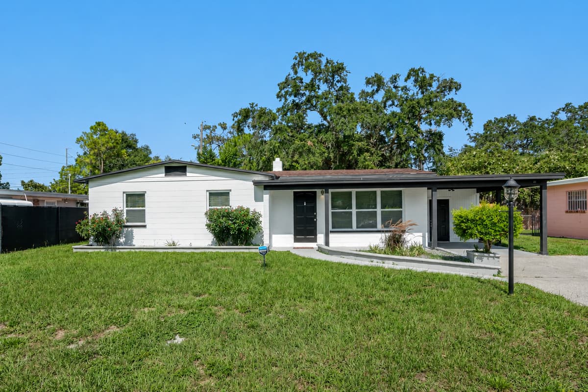 Stunning front view of the house showcasing the front yard and parking area that is equipped with CCTV cameras to ensure your safety during your stay. If you are interested in this property, send us an inquiry now!