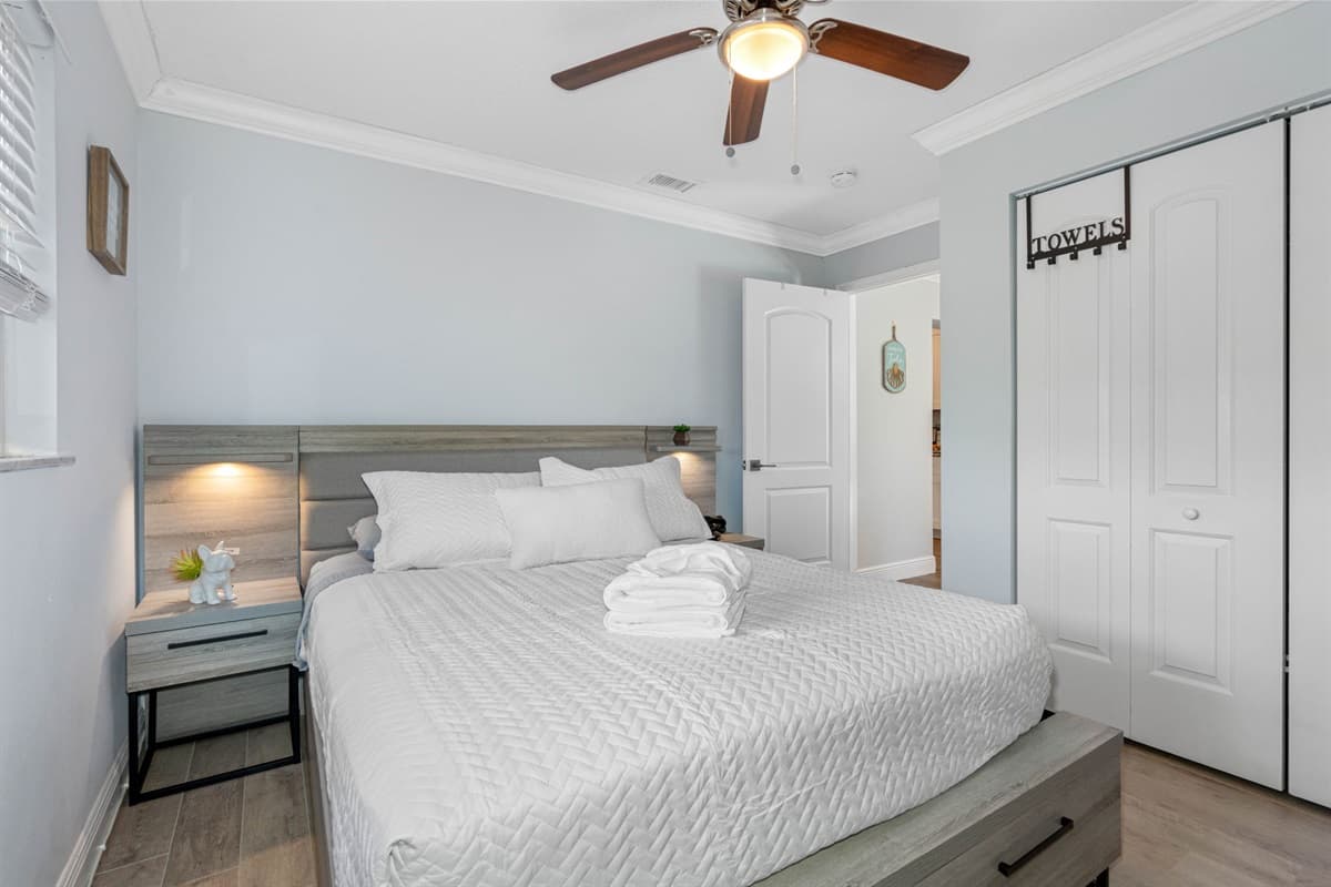 This inviting space features a queen-size bed, ensuring a restful night's sleep with its plush mattress and high-quality linens.