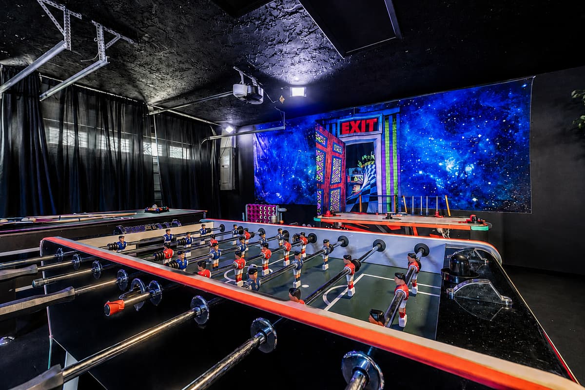 Foosball with the lights down and the walls glowing. The tournament runs until someone gives up.