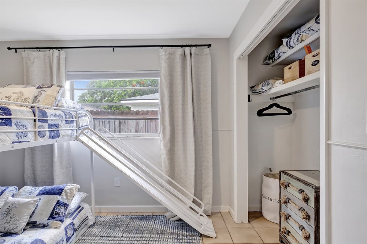 With vibrant colors and a cozy atmosphere, this bedroom is a canvas for creativity and relaxation.
