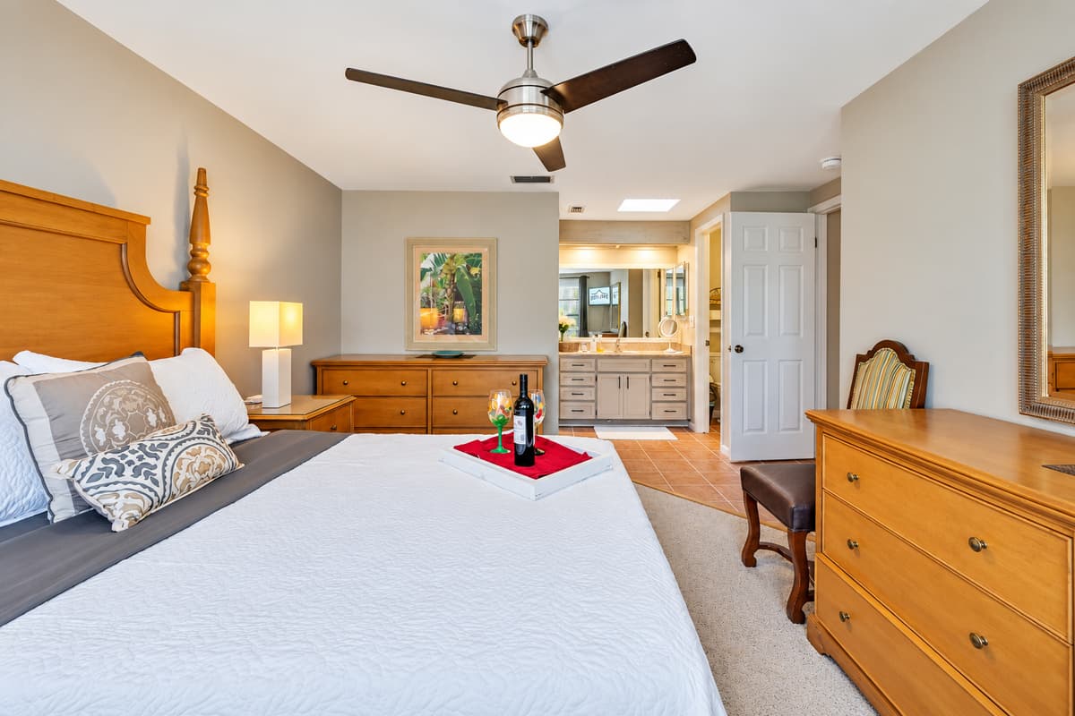 Sink into the sumptuous queen-size bed, adorned with crisp linens and plush pillows, promising a restful night's sleep.