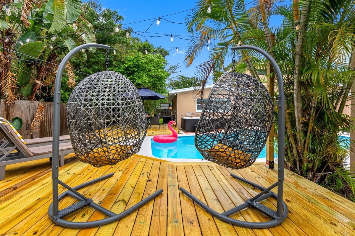 Whether you're sunbathing or stargazing, this tropical-inspired pool deck delivers all the island vibes.