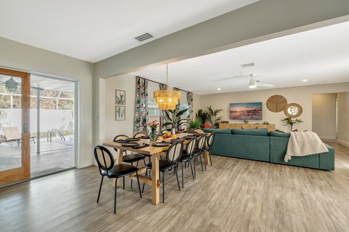Natural light filters through large windows, casting a soft glow over the room during the day.
