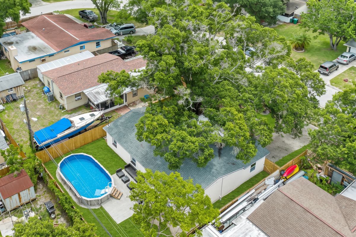 Aerial top view of our incredible house showcasing the beautiful swimming pool!
