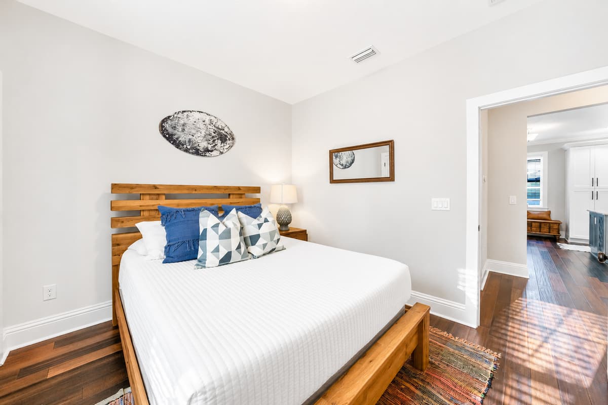 Unwind in this spacious queen bedroom with comfortable furnishings and easy access to the shared bathroom.