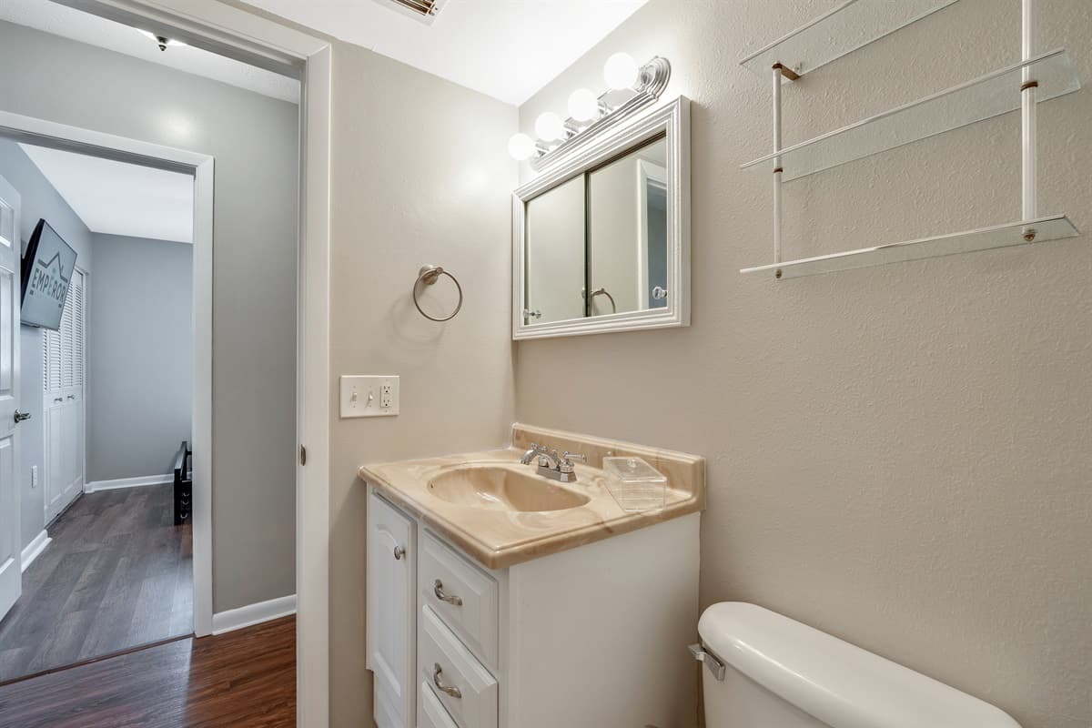 Soft, ambient lighting throughout the bathroom creates a calming atmosphere, ideal for unwinding after a long day.