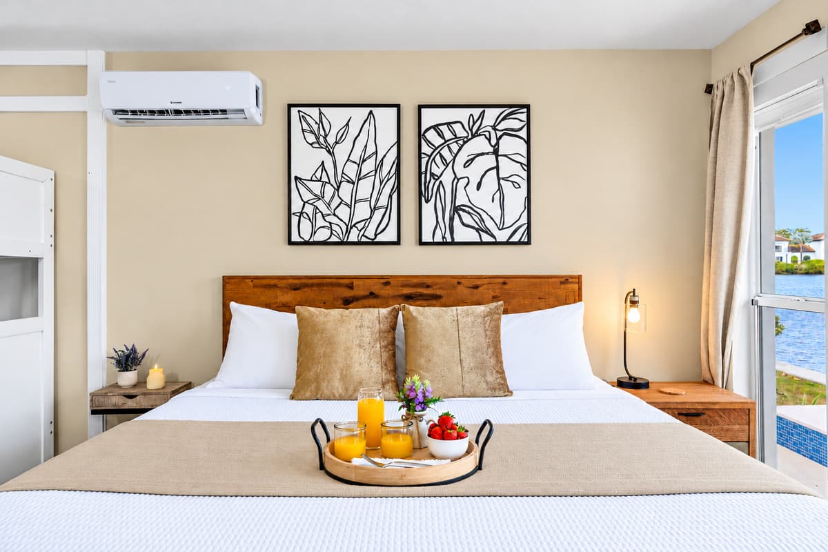 Comfortable king bedroom with stylish décor and convenient bunk beds for kids.