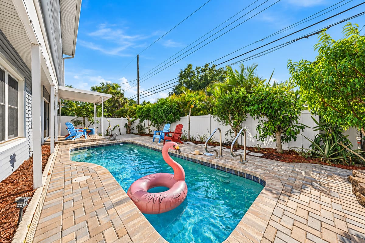 Private backyard oasis with sparkling pool, lounge seating, and plenty of space to relax under the Florida sun.
