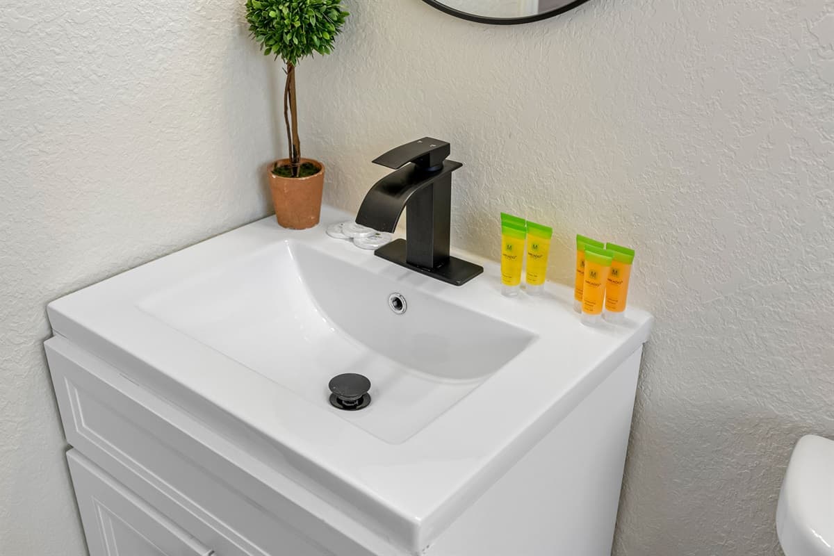 The bathrooms are thoughtfully appointed with contemporary fixtures, clean lines, and calming neutral tones, creating a serene environment that feels fresh and inviting.