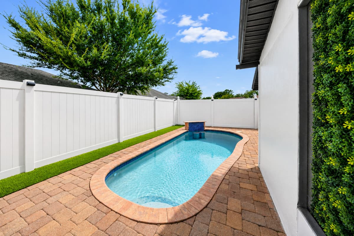 Relax poolside and enjoy the tranquil backyard setting designed for comfort, privacy, and outdoor enjoyment.