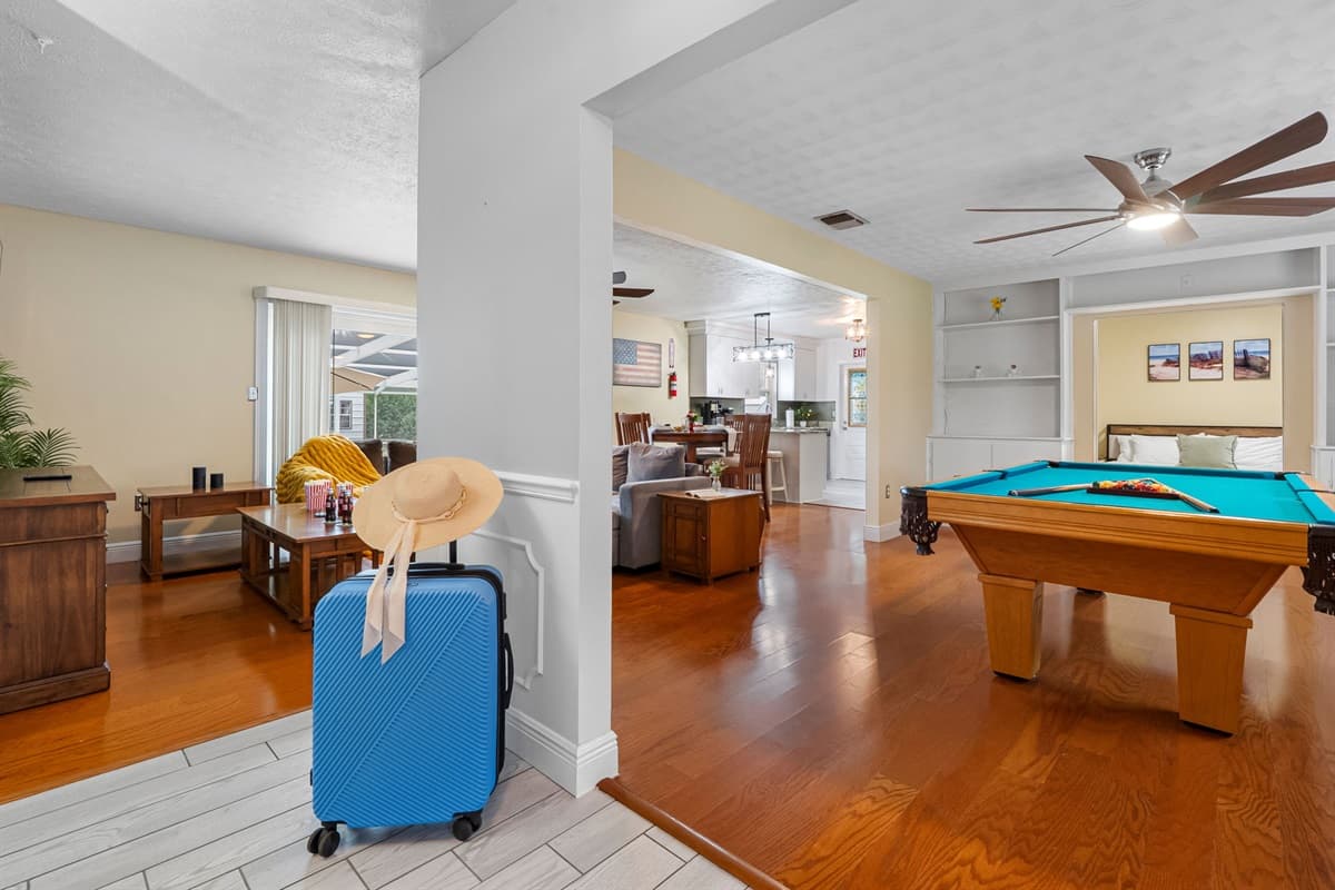 Enjoy friendly competition in this bright game room featuring a full-size pool table.