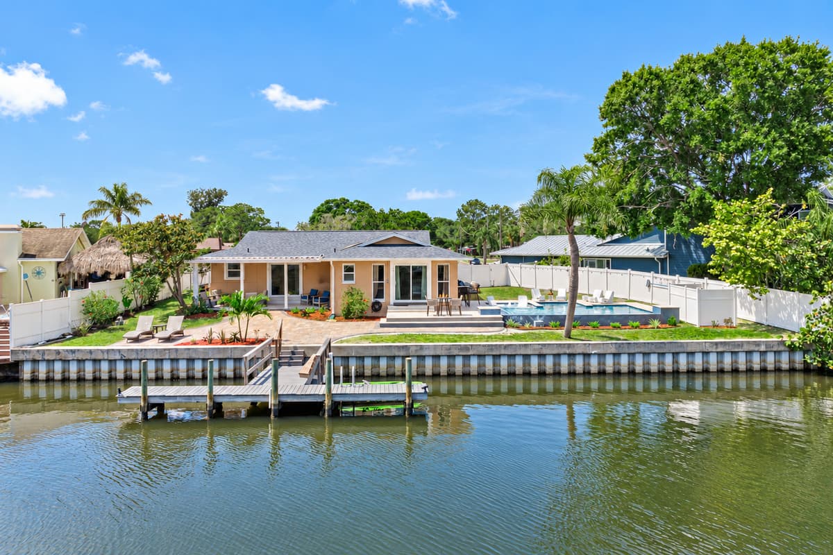 Nestled along the tranquil shores of a picturesque water canal, this architectural masterpiece offers a truly exceptional living experience.