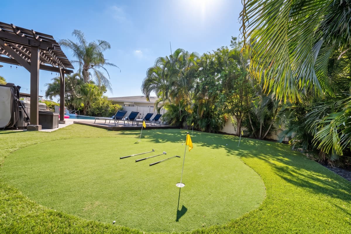 A private putting green adds a playful bonus activity right in the backyard