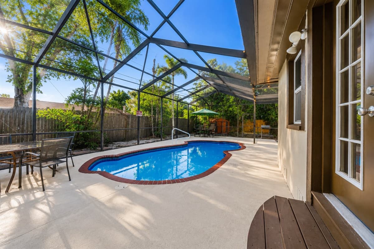 Bright poolside view with easy access to the patio and outdoor entertainment spaces.