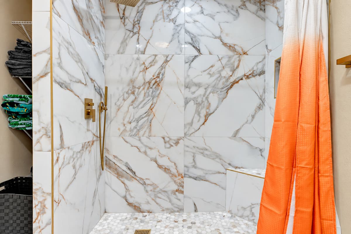 Our beautiful bathroom - Opulence meets tranquility with its elegant cream, marble, and gold theme.