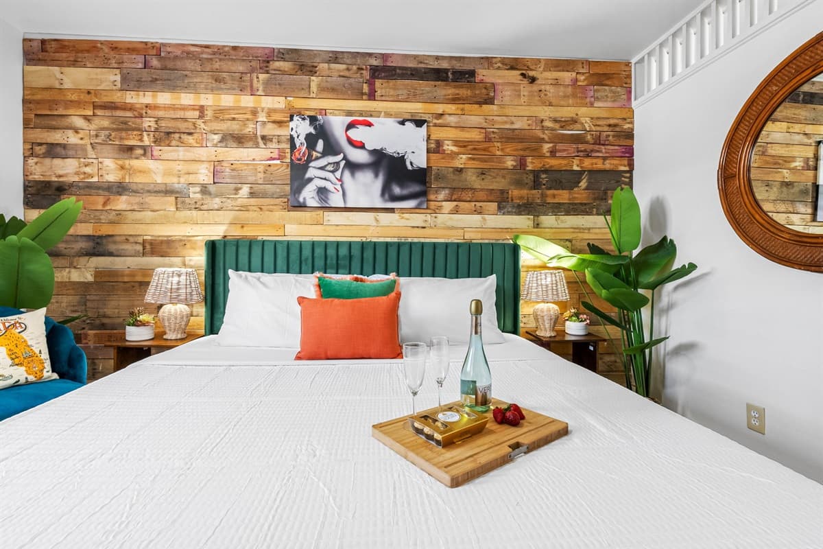 The bedroom features a luxurious king-size bed adorned with premium linens, ensuring a restful night's sleep.