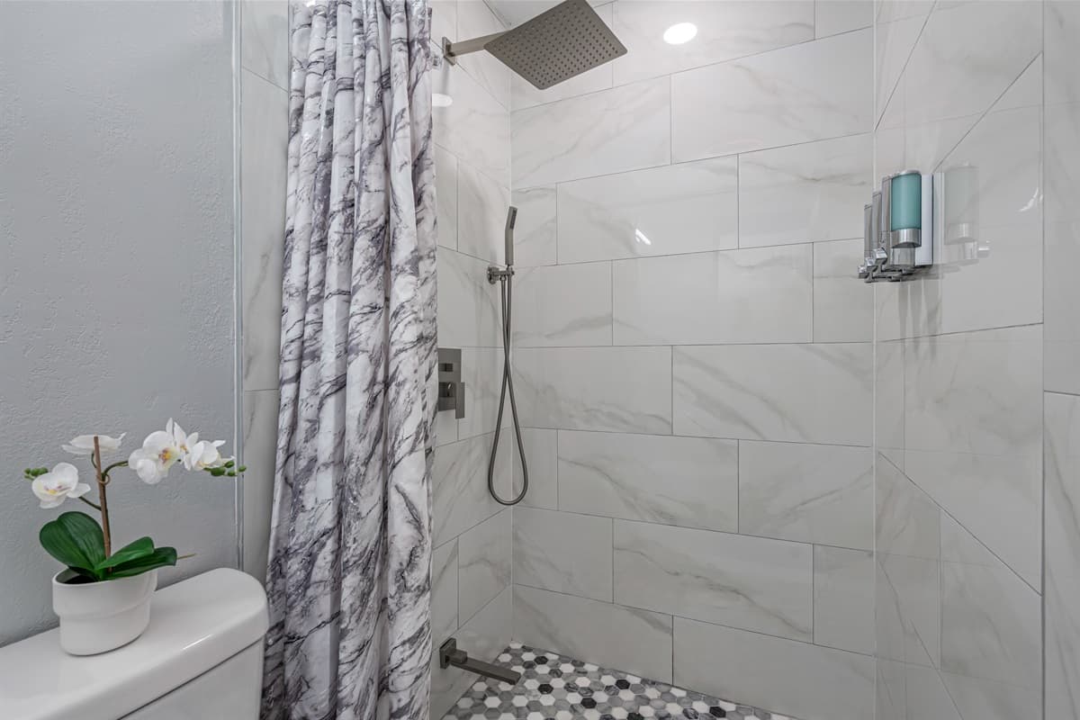 Great bathroom with toilet, sink, and walk-in shower. Feel fresh and clean after a long day of travel from your home to your home away from home. If you are interested in this property, send us an inquiry now!