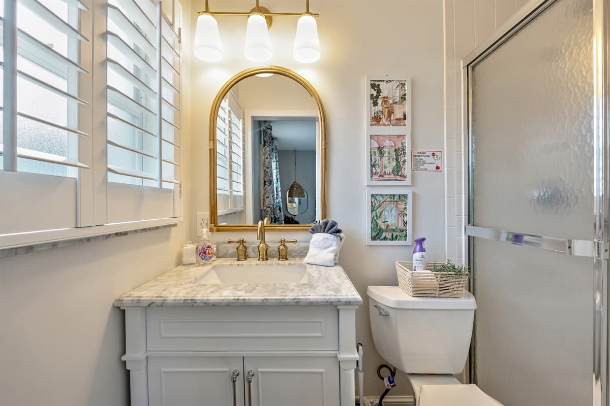Soft, ambient lighting throughout the bathroom enhances its tranquil atmosphere.