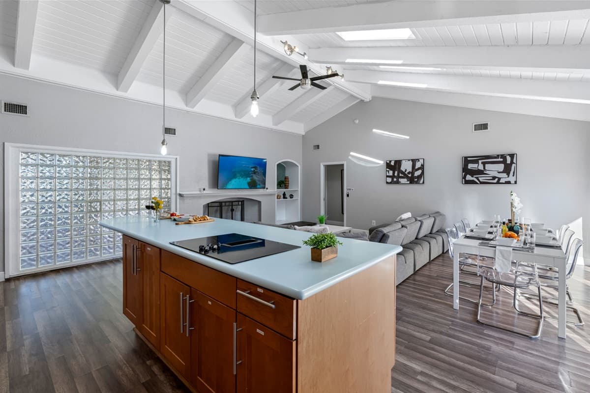 Clean lines, wood cabinetry, and soft lighting give this kitchen a polished, upscale feel.