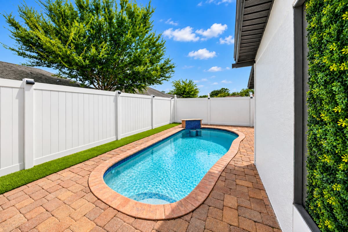 Relax poolside and enjoy the tranquil backyard setting designed for comfort, privacy, and outdoor enjoyment.