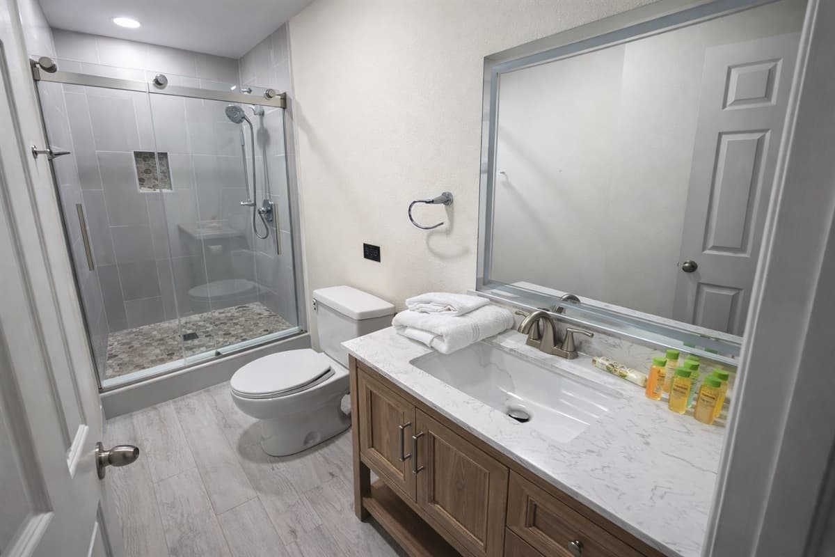 The light wood-look flooring and neutral color palette create a calm and welcoming atmosphere.