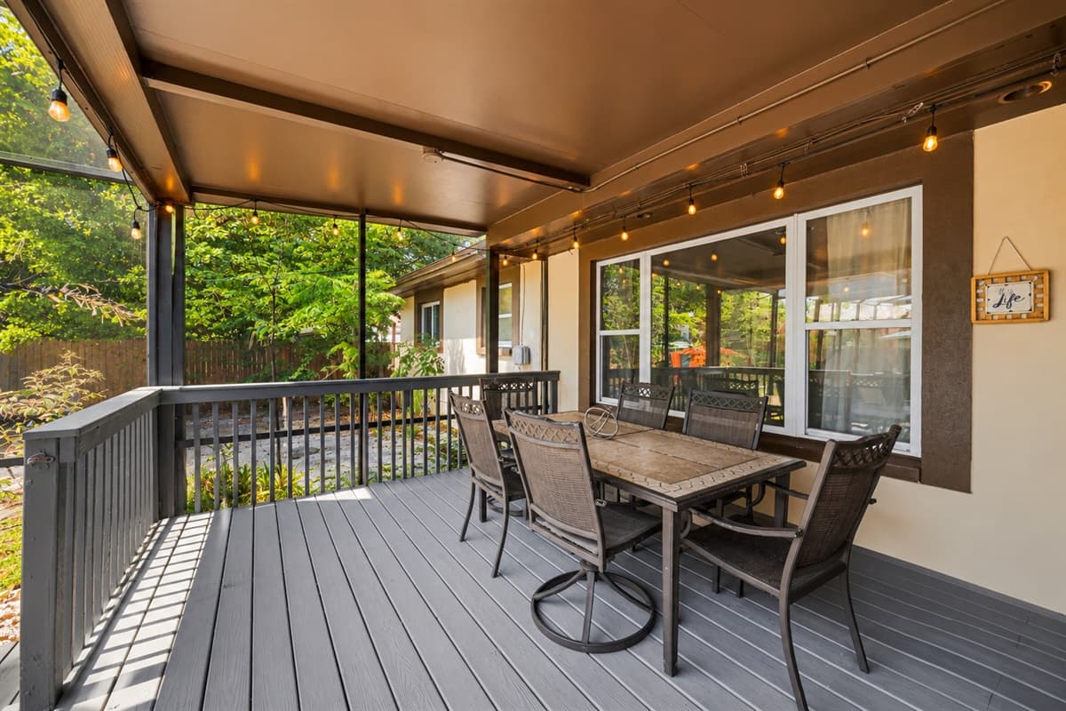 Covered patio dining area perfect for outdoor meals and gatherings with family and friends.
