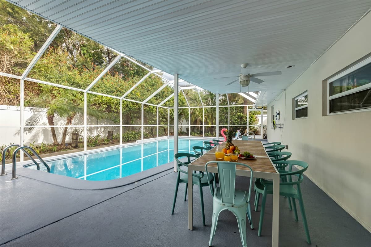Outdoor dining table with comfortable seating provides the perfect spot to enjoy meals or snacks.