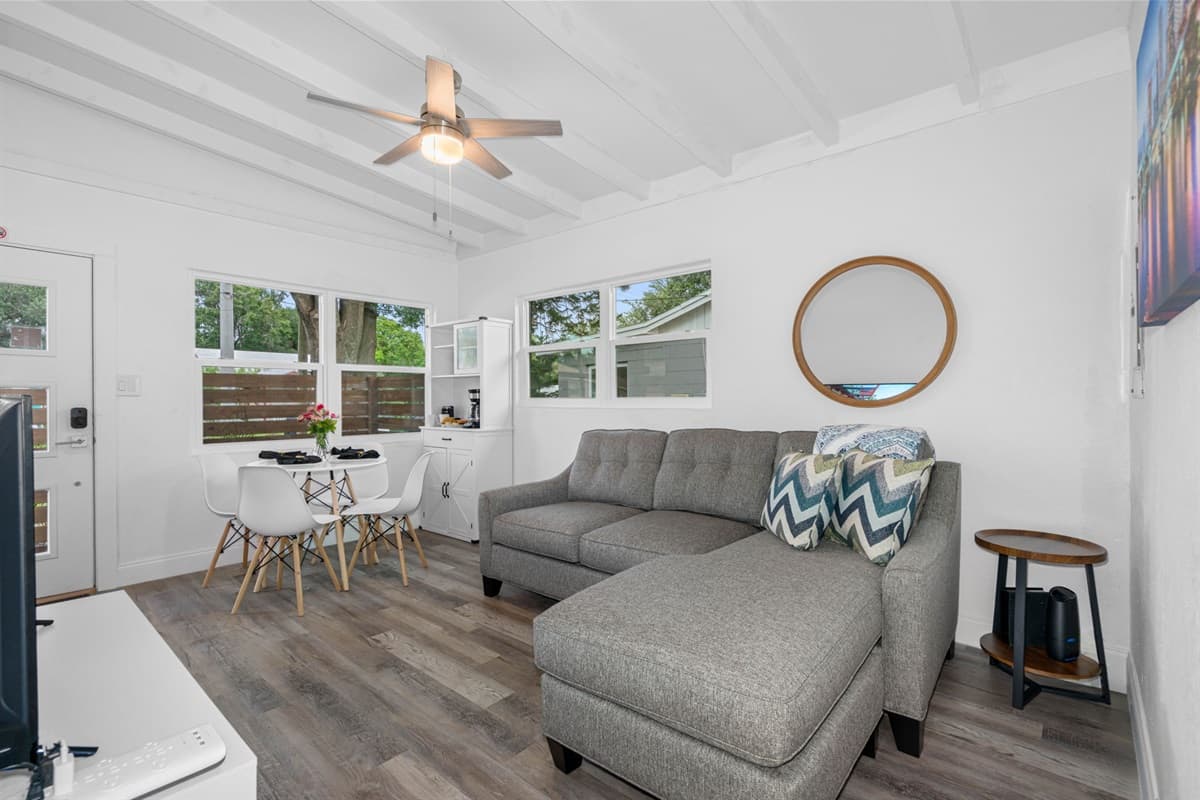 The ambiance of the living room is further enhanced by carefully planned lighting.