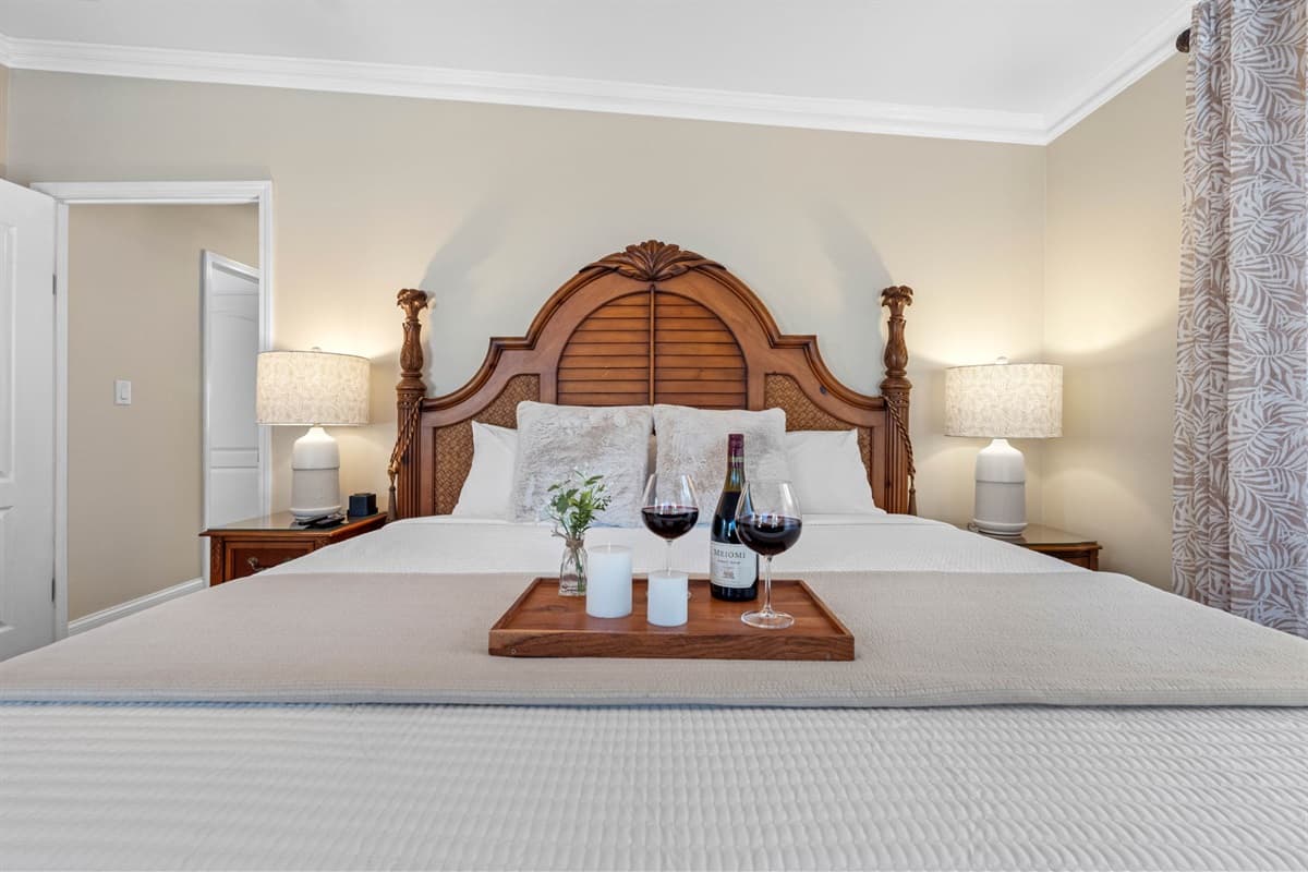 Soft ambient lighting and decor pieces enhance the room’s relaxing coastal aesthetic.