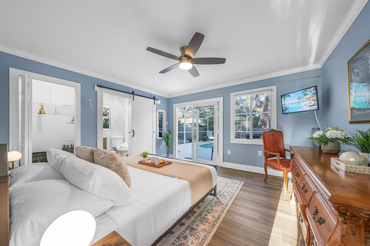 This bright and airy king bedroom offers a serene setting ideal for unwinding and restful sleep.