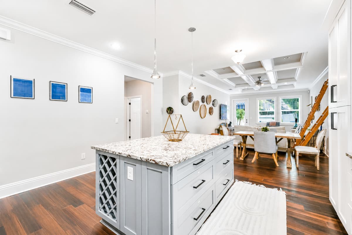 A beautiful view of the kitchen, dining, and living areas, designed for spending time together with family and friends.