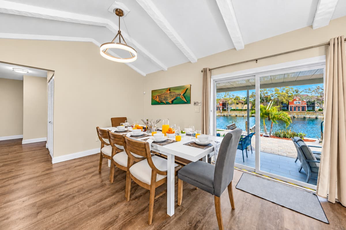 Elegant dining table set for memorable meals overlooking the water.