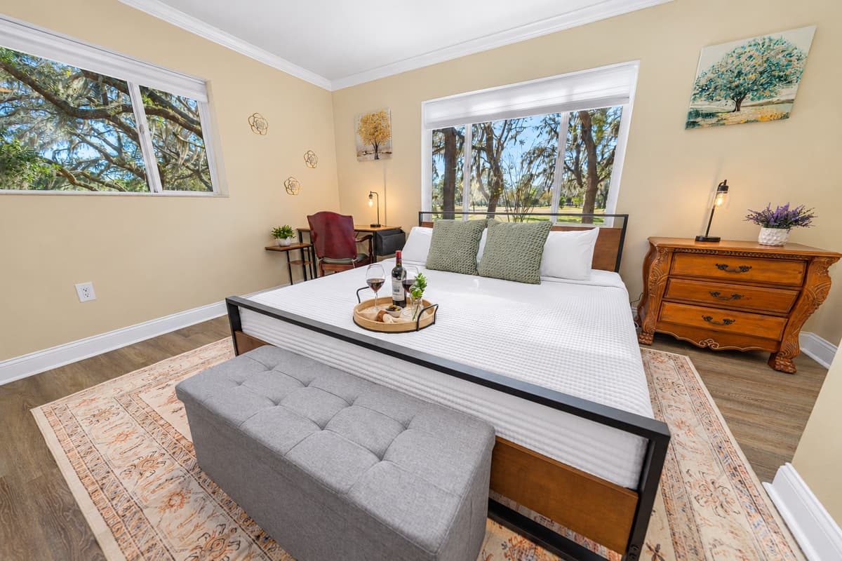 This welcoming bedroom offers a king-size bed, tasteful furnishings, and a calm ambiance ideal for a restful stay.