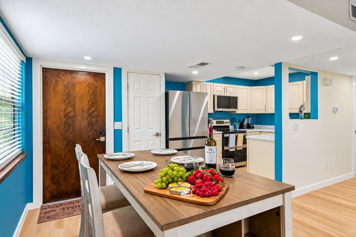 Surrounded by comfortable chairs, the dining table creates an intimate setting that encourages engaging conversations and shared moments of laughter and joy.